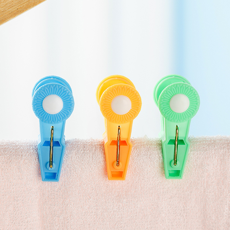 Pinzas pequeñas de plástico con resorte metálico, coloridas, para ropa o uso multifuncional.