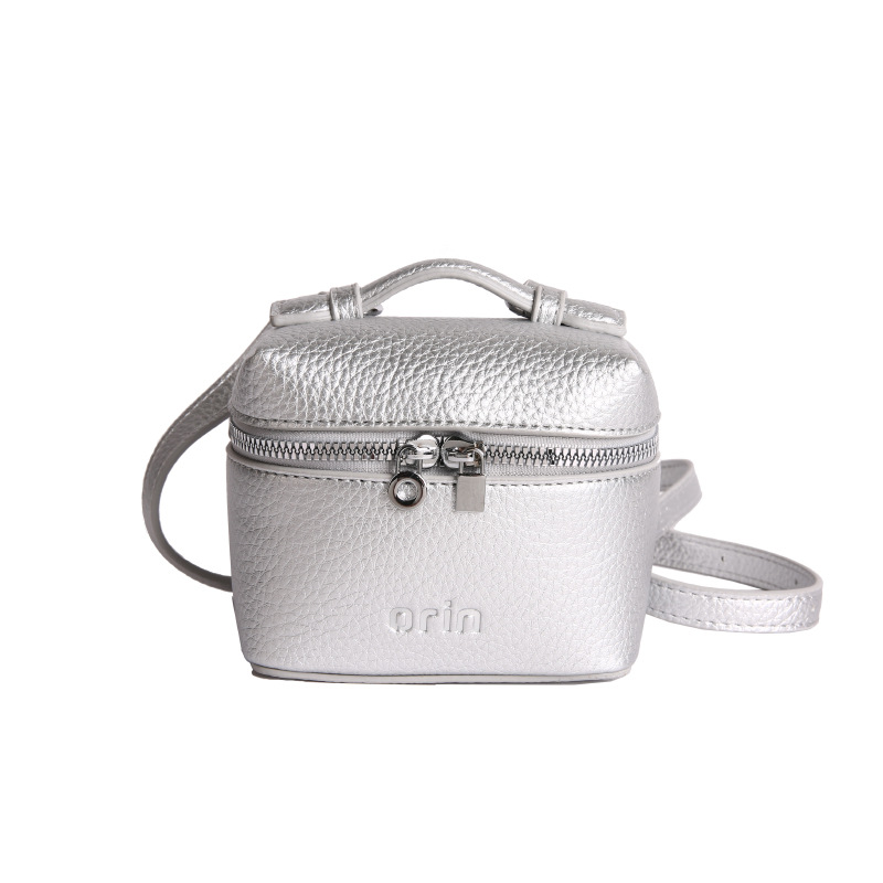 2026 nuevo bolso infantil coreano litchi patrón bolso de caja para hombres y mujeres bolso de cambio de color sólido mini