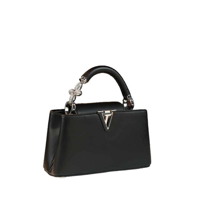 Cuerpo suave de cuatro hojas con tapa flip 2025, nuevo estilo de lujo ligero bolso de mano de lujo, bolso de moda, bolso de diamante exquisito