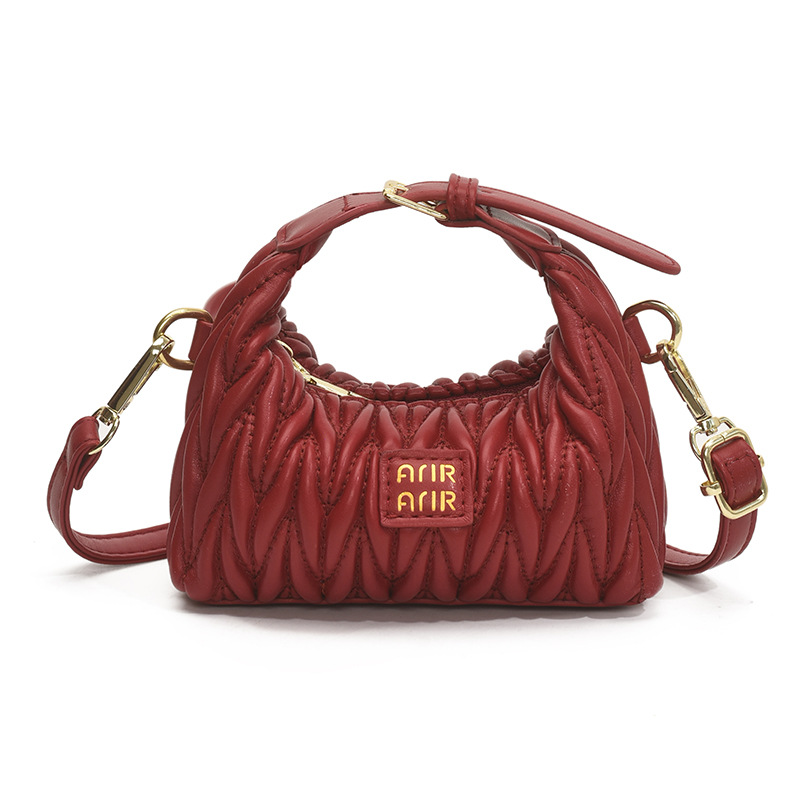 Bolsa de hombro de chicas plegadas de moda simple color sólido mini bolso de bebé 2025 nuevo bolso infantil transfronterizo