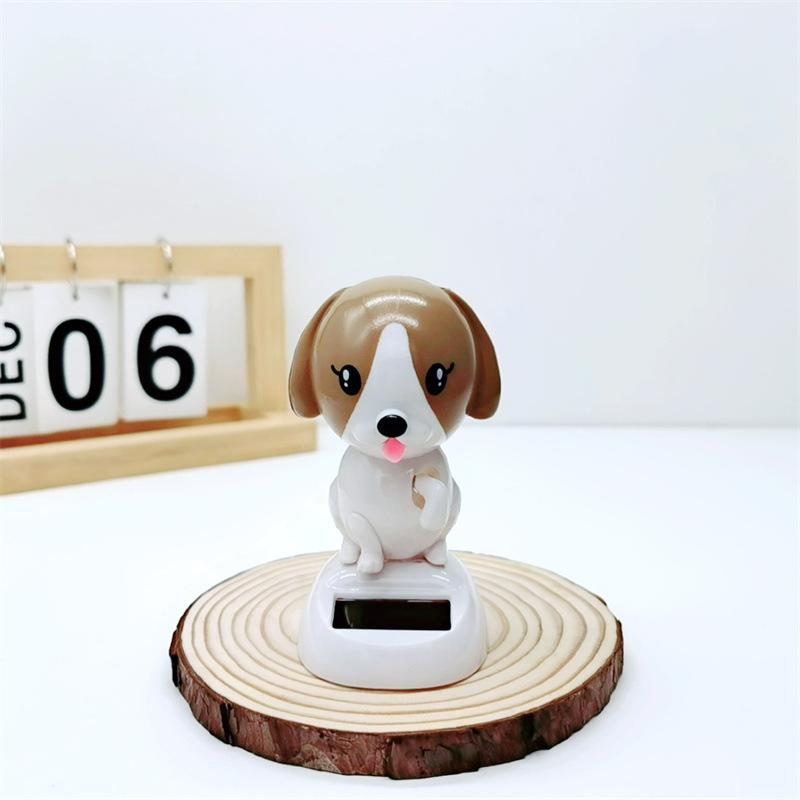 Adornos para automóviles cruzados, decoración para automóviles de resina, accesorios interiores para perros de palomitas de maíz para automóviles solares, sacudiendo la cabeza y llamando a la muñeca