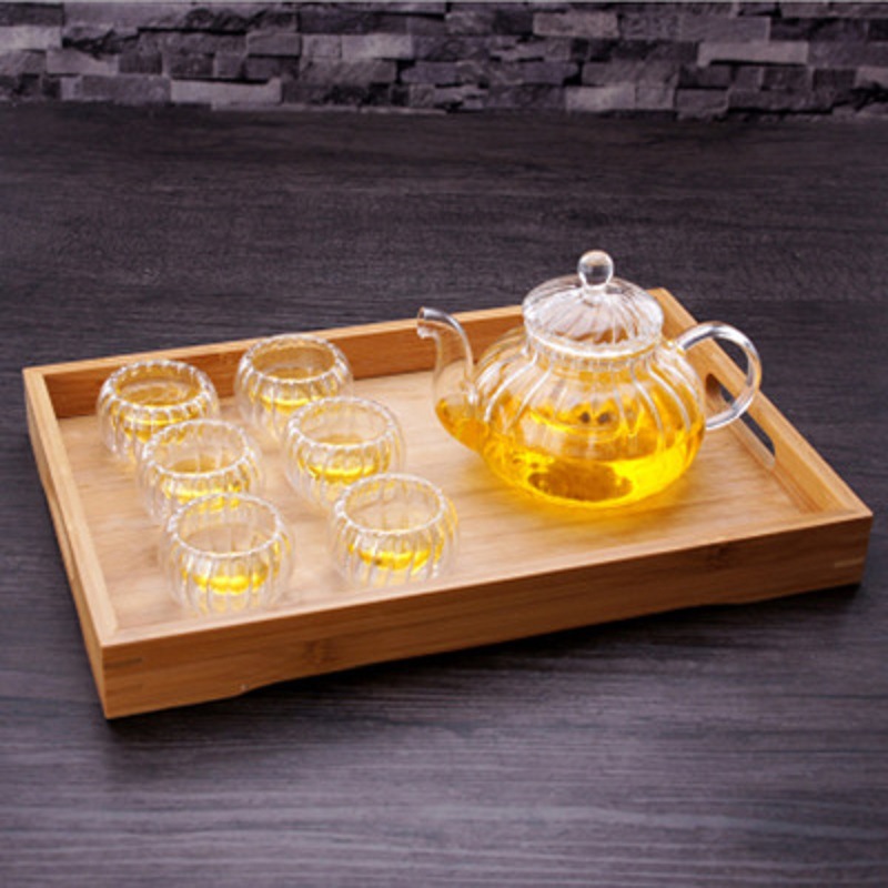 Venta al por mayor de borosilicato resistente al calor juego de té de vidrio engrosado Filtro de flores y hierba tetera a rayas calabaza olla traje de entrega de una sola pieza