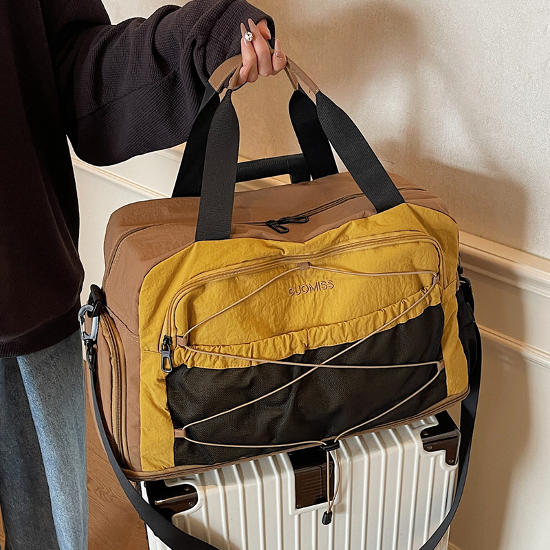 Nicho de diseño de moda moda moda bolsa de mano de mujer gran capacidad bolsa de viaje corto bolsa de almacenamiento bolsa de viaje deportiva al aire libre