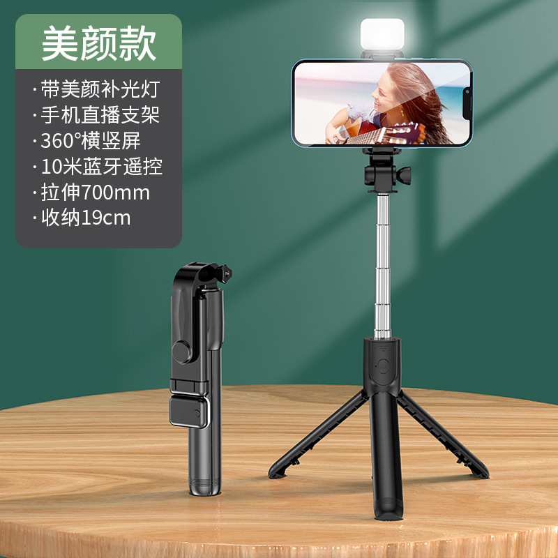 Ventas directas de fábrica teléfono móvil Bluetooth selfie stick trípode llenar luz selfie stick mini portátil de mano Cámara artefacto
