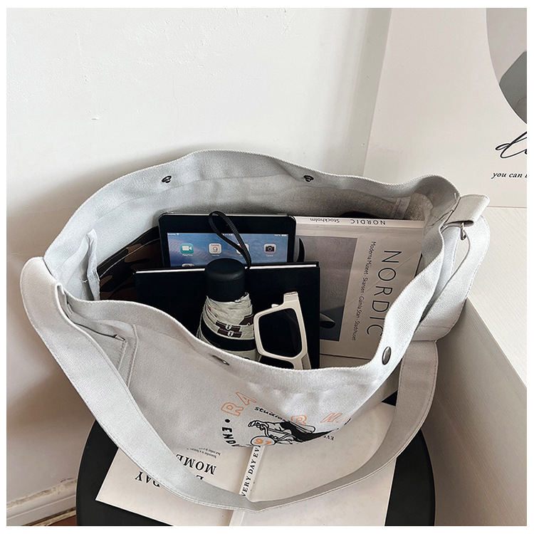 Wholesale large-capacity casual commuting women's single-shoulder bags, Korean-style trendy and fashionable handbags, LOGO printed canvas bags undefined