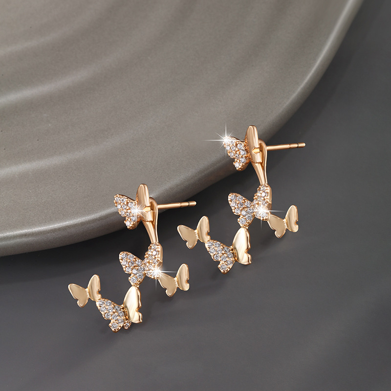 Pendientes de mariposa de oro de la joyería de Xupin elegantes pendientes de nicho diseño de las mujeres pendientes de dos piezas de lujo ligero de alto grado image 6