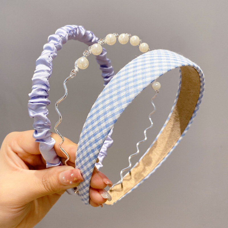 A principios de la primavera, la banda de cabello para mujeres en línea, 2025 nuevo lavado de cara de presión de tarjeta de cabello para el cabello, banda de cabello de perlas, banda de cabello para mujeres.