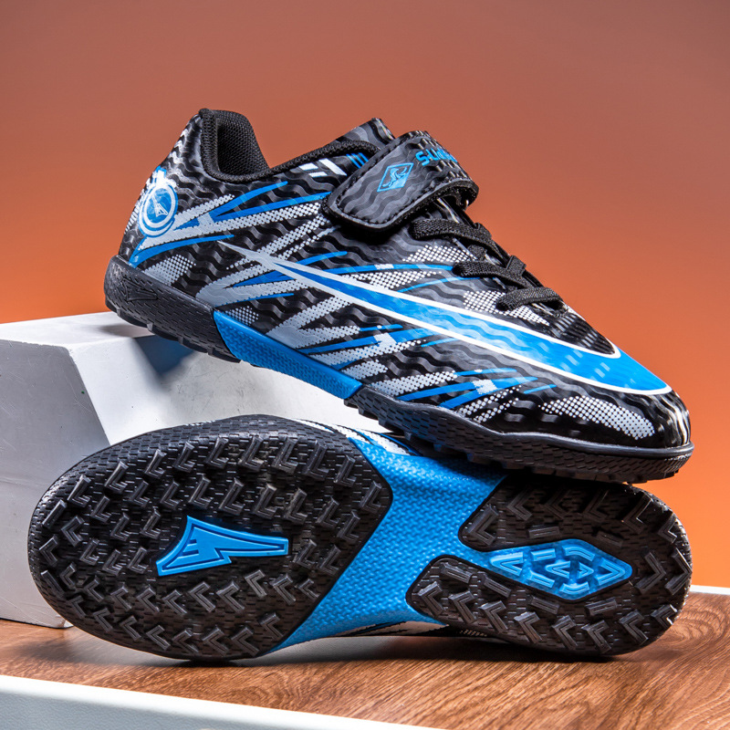 Zapatos de fútbol transfronterizos de alto perfil para hombres TF zapatos de entrenamiento antideslizante transpirables para niños zapatos deportivos profesionales para estudiantes