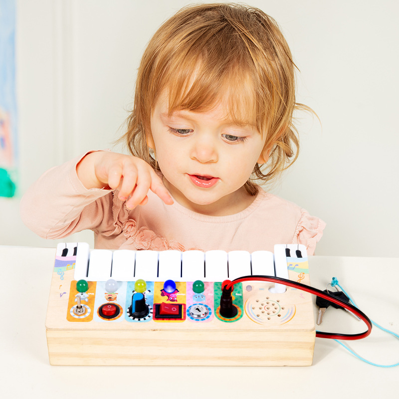 Transfronterizo de madera multifuncional órgano electrónico niños Montessori educación temprana interruptor LED luz bebé caja de música juguetes educativos