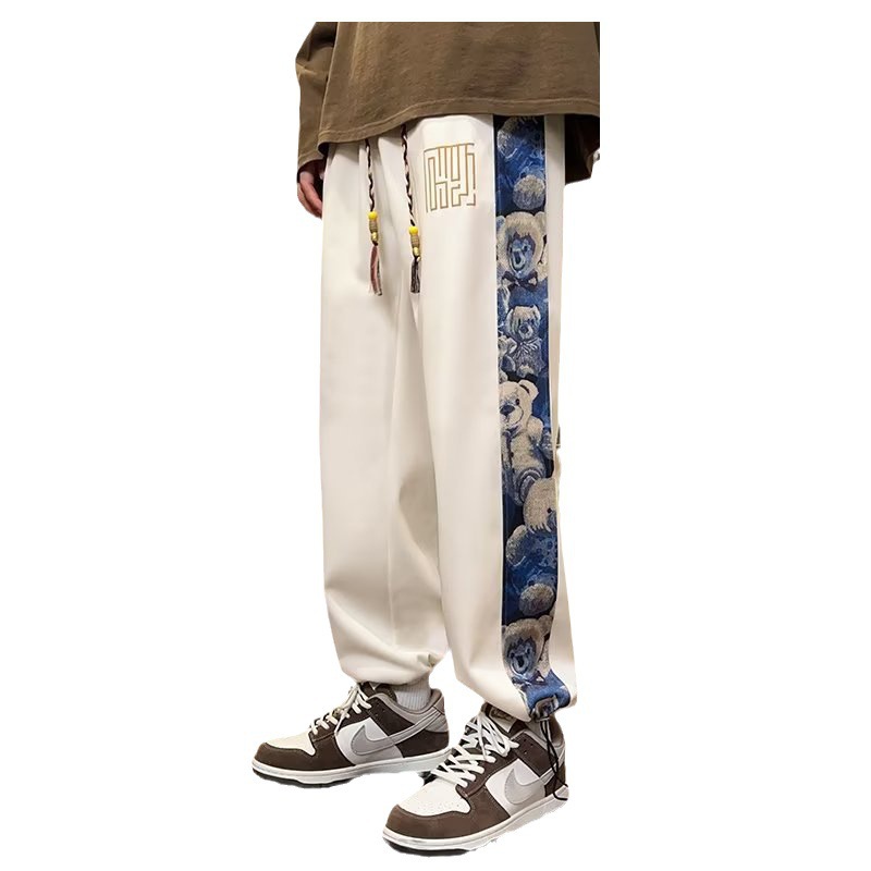 Pantalones de oso de marea nacional de primavera y otoño de los hombres marca de moda recta suelta pierna ancha 2025 nueva tendencia pantalones casuales de todo fósforo