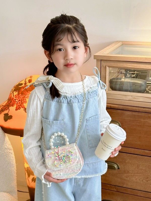 Bonito bolso de niños en línea nueva moda extranjera bebé niña princesa cambio de hombro mochila de moda