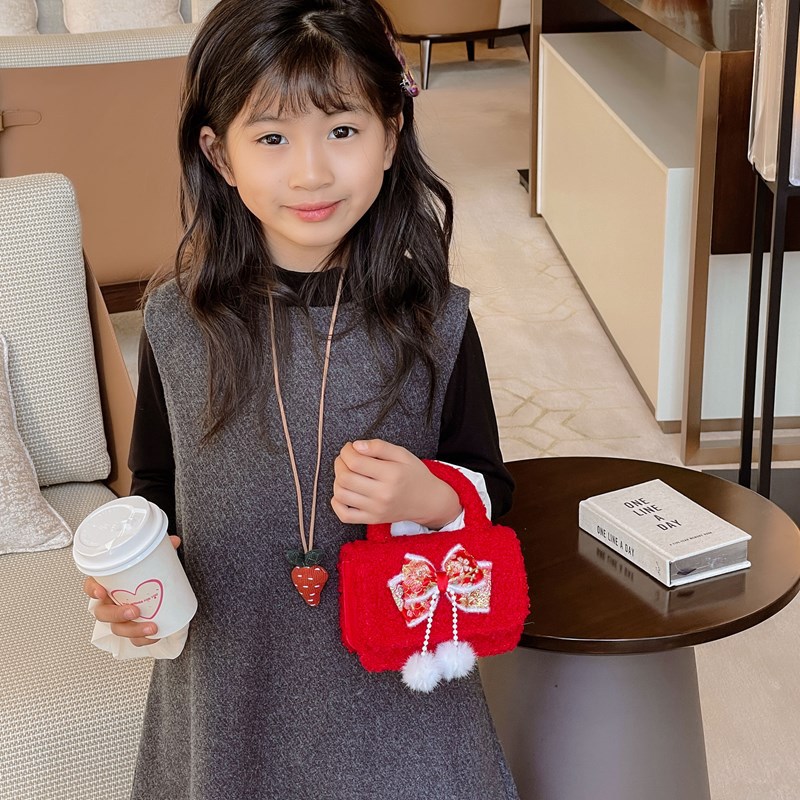 Bolsa de hombro de niña roja de Año Nuevo lindo arco borracha bolsa de bebé 2025 nueva cadena bolsa de niños