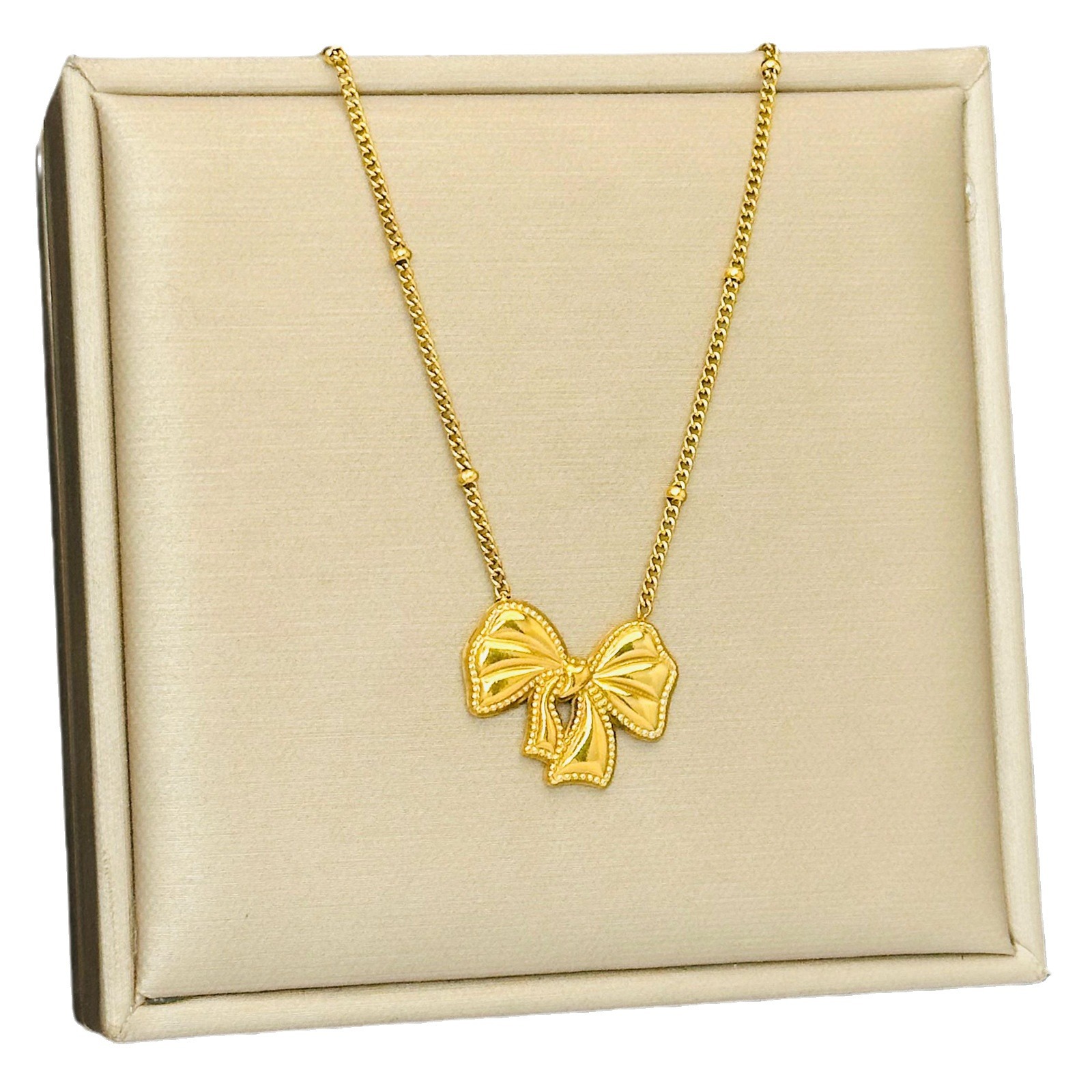 Bow set pendientes ligero lujoso estilo transfronterizo colgante de acero de titanio no decolor 18K joyas de oro ins