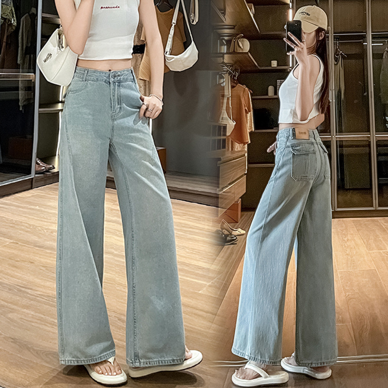 Vintage light blue split-line wide-leg jeans for women, high-waisted, washed, distressed, drapey, floor-length, loose straight-leg pants Vintage light blue split-line wide-leg jeans for women, high-waisted, washed, distressed, drapey, floor-length, loose straight-leg pants