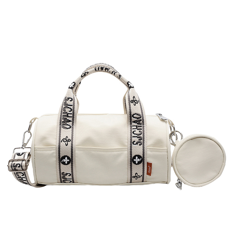 Oxford tela de contraste de color ligero bolso cilíndrico de mano casual para mujeres 2025 nuevo alto valor ocio transporte de viaje mochila