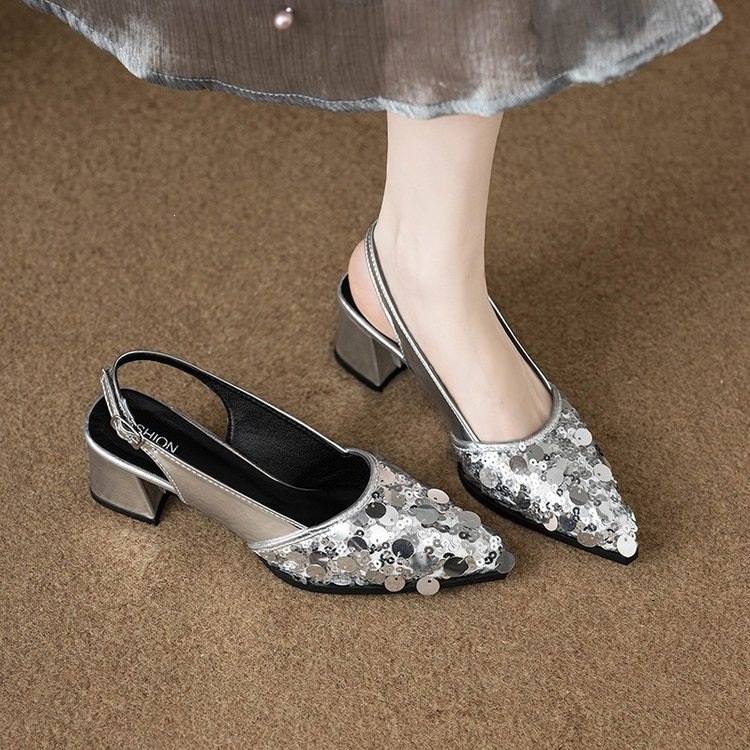 Shiny fashionable elegant shoes pointed-toe heels