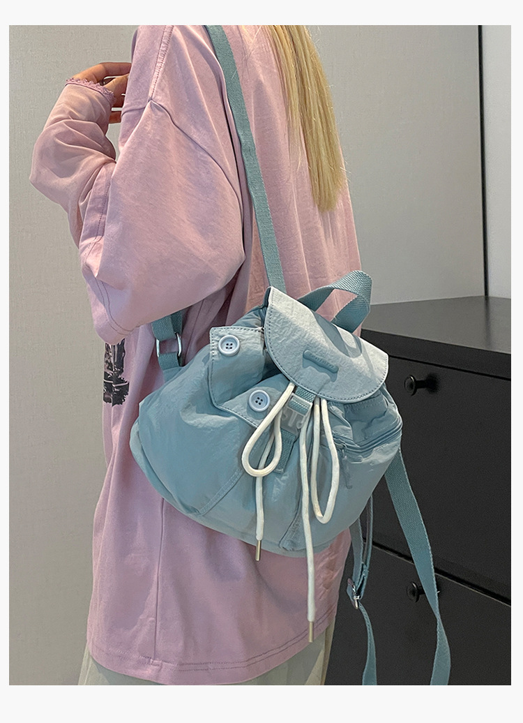 Colorful Fox's new Korean-style ins women's niche design lightweight pocket button drawstring backpack undefined