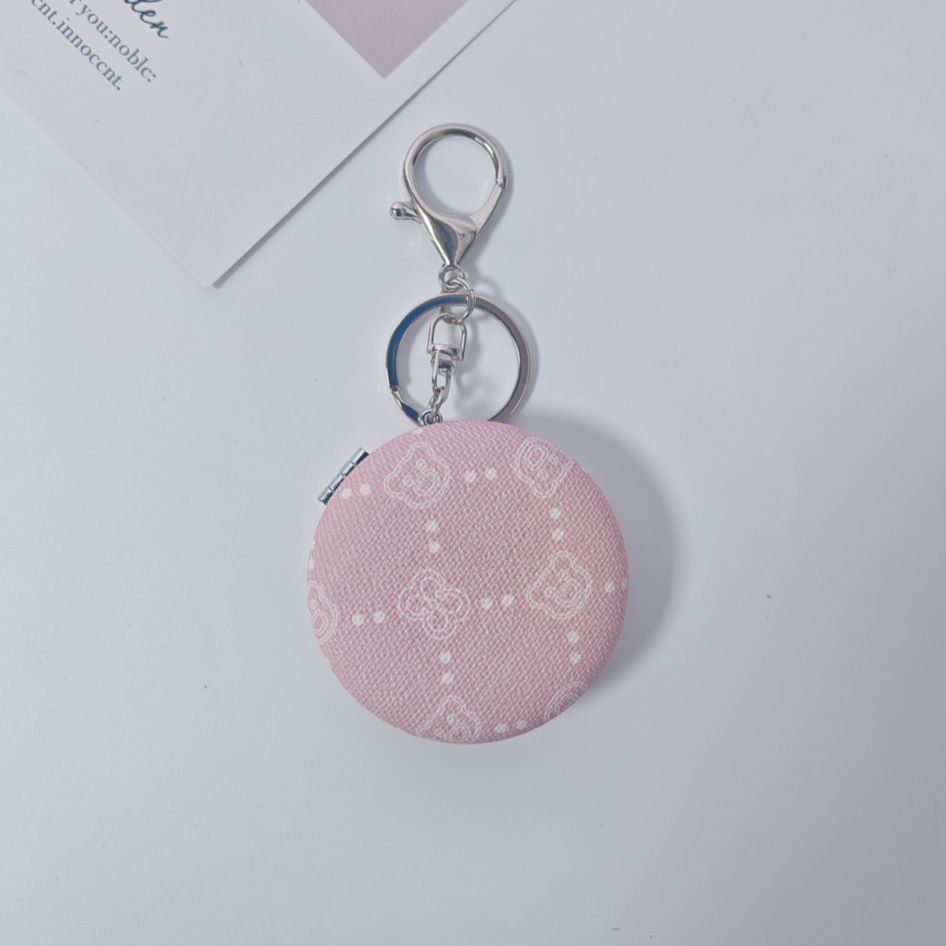 Bolsa de espejo popular en línea colgante de lujo ligero llavero portátil espejo de maquillaje transfronterizo colgante de bolsas de espejo doble cara