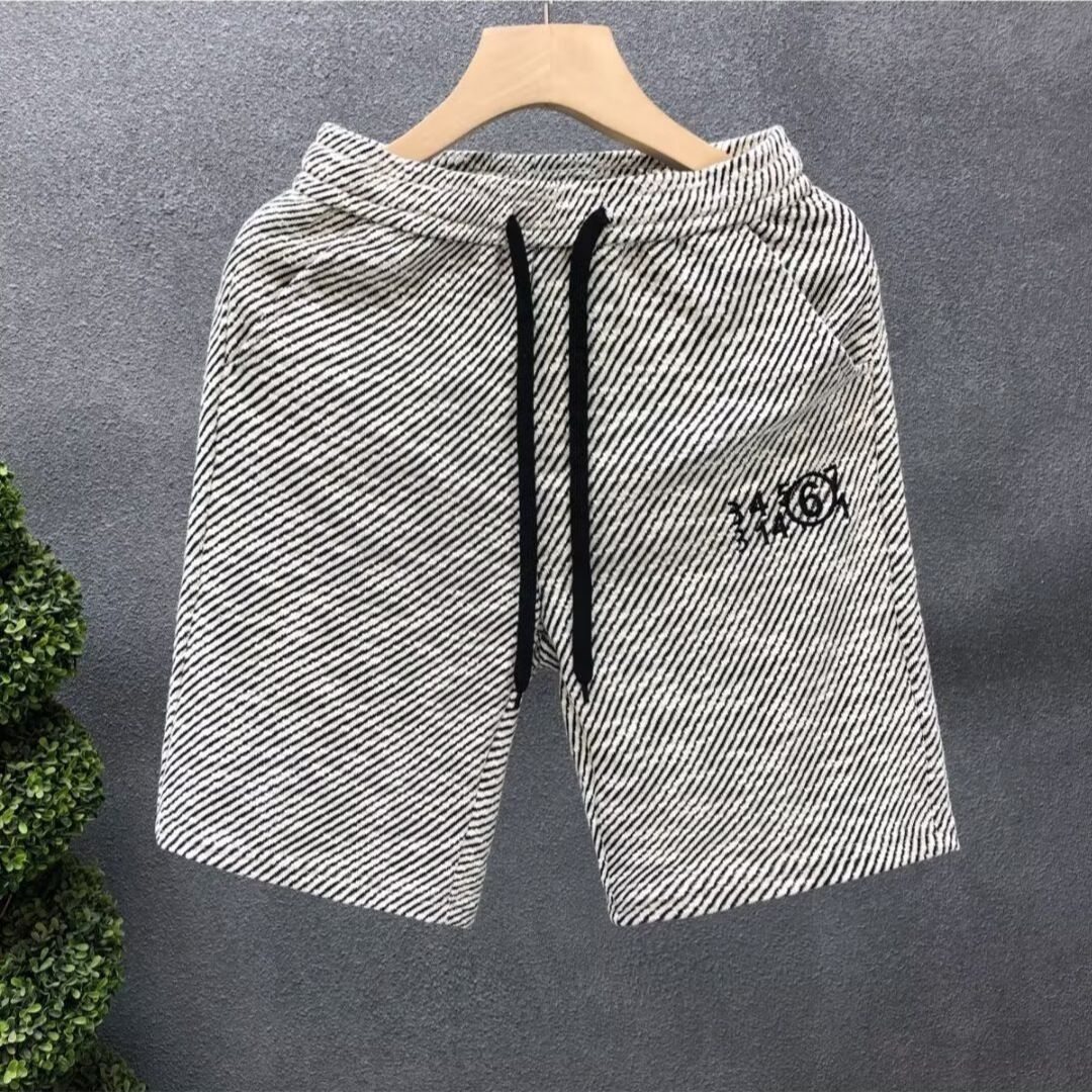 Verano delgado estilo americano retro sensación de diseño simple pantalones cortos a rayas nicho de hombre grande pantalones casuales sueltos