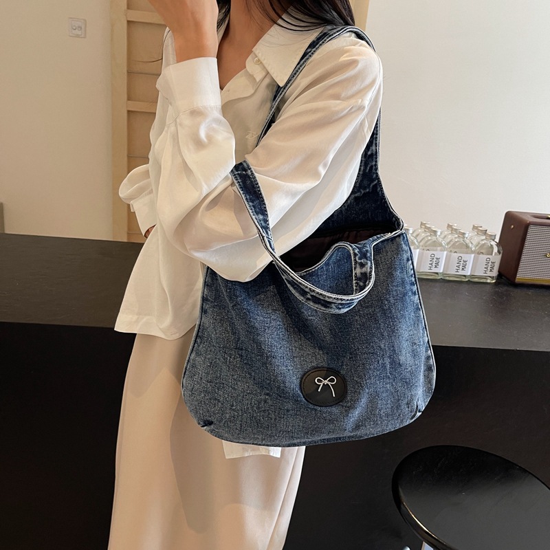 Bolso de viaje retro de mezclilla de alta gama, bolso de viaje de marca de moda de moda femenina, bolso de axila de hombro simple y casual de gran capacidad