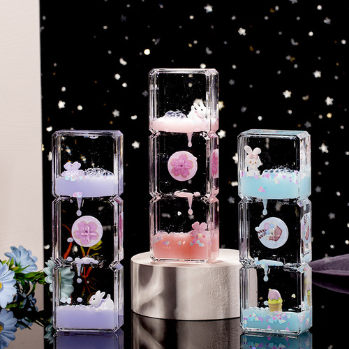 Geometric three-square cartoon rabbit enters oil and drops children's hourglass toy as a creative birthday gift for classmates