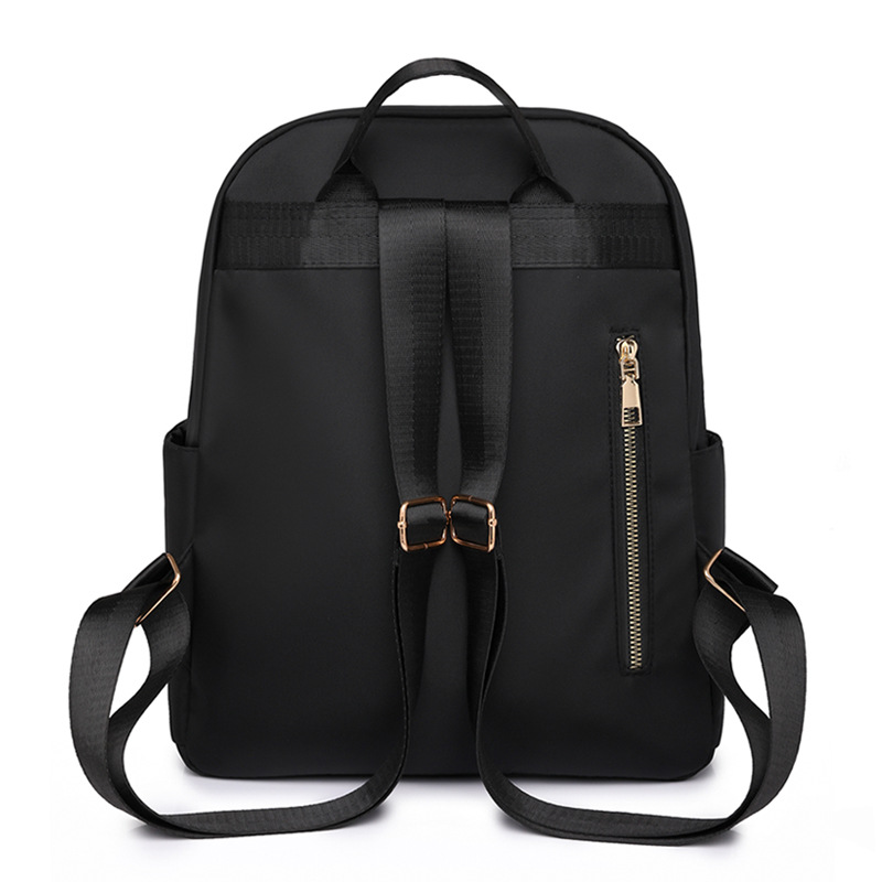 Comercio exterior al por mayor 2023 nueva versión coreana de la mochila de nailon para mujer, línea de bordado de moda, mochila de viaje al aire libre de todo fósforo, marea