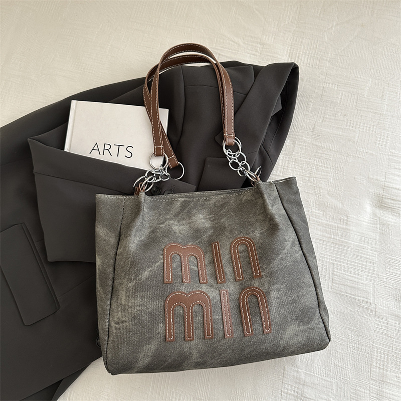 Bolso de otoño de mujer de gran capacidad de transporte 2024 nuevo bolso de hombro de moda nicho de alto nivel bolso de brazo