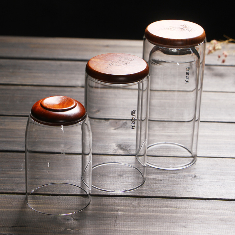 Vidrio transparente grueso resistente al calor inferior de madera aislamiento térmico de doble capa taza de té verde taza de agua creativa flor taza de té Tianjiu glass