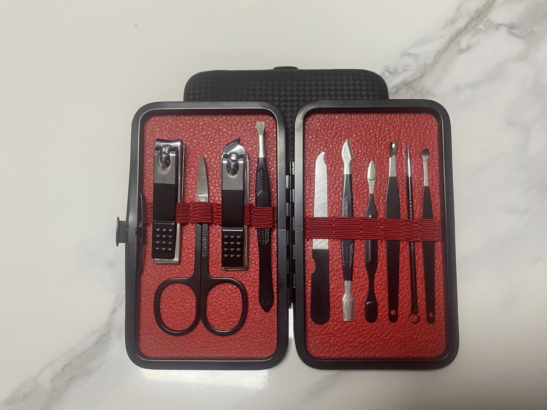 Nuevo juego de cortaúñas semi-negras de gama alta transfronterizo alemán juego completo de 7-24 piezas de herramientas de uñas de acero inoxidable en stock