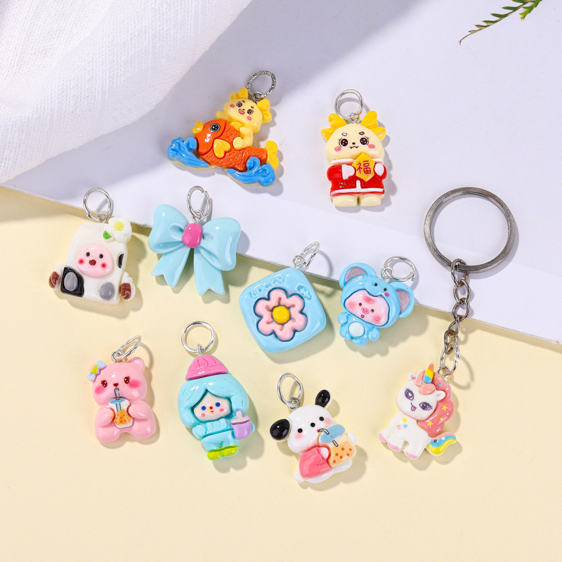 Llavero de material de resina de dibujos animados al por mayor, accesorios lindos, colocación creativa, colgante de bolsa portátil