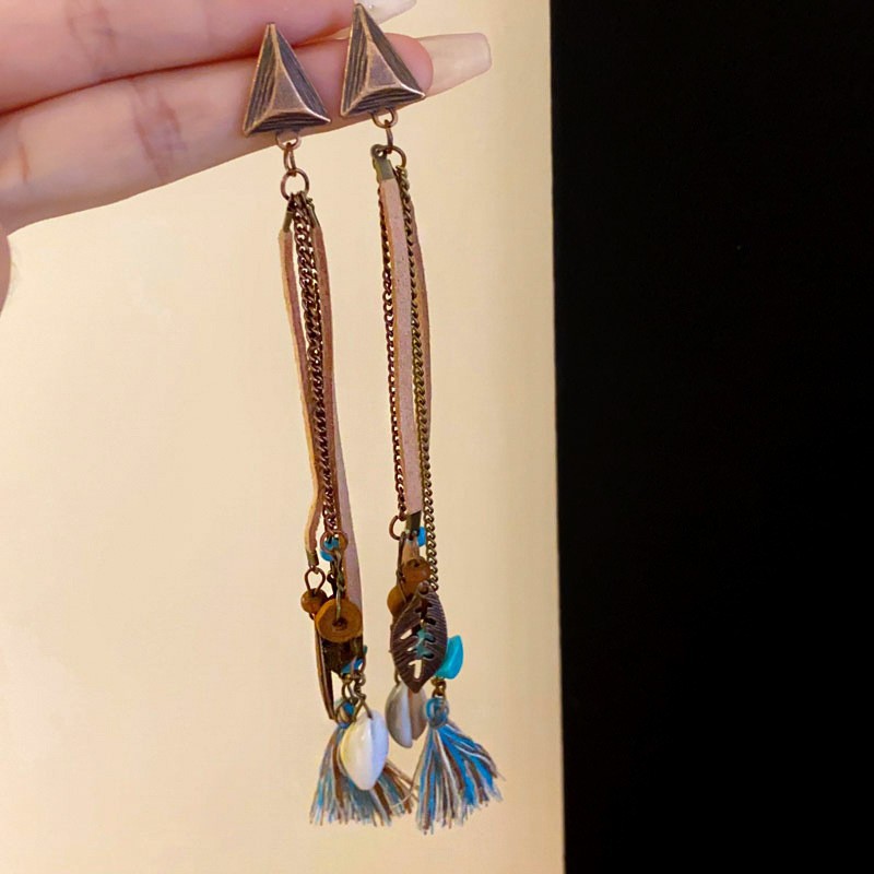 Pendientes de borla de cuentas de arroz con plumas de gota de agua bohemia Pendientes de estilo de vacaciones retro de nicho Pendientes de estilo étnico de lujo ligero