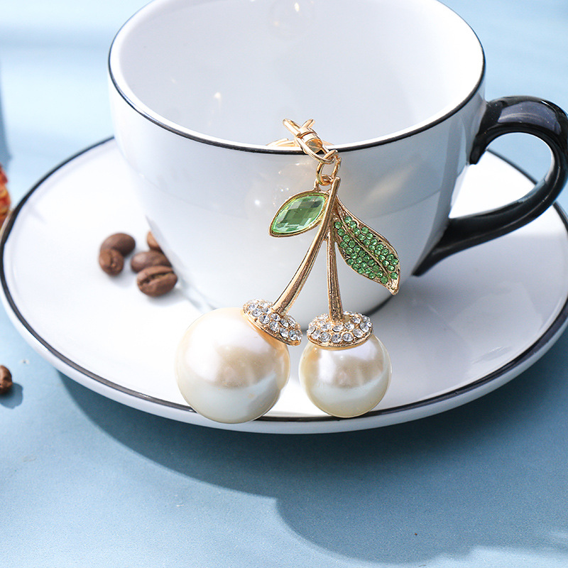 Deli Reba con colgante de bolsa de coche de frutas Llavero de metal coreano creativo transfronterizo