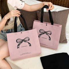 蝶結び不織布手提げ袋服装店服用卸売り高級端logoショッピング包装袋