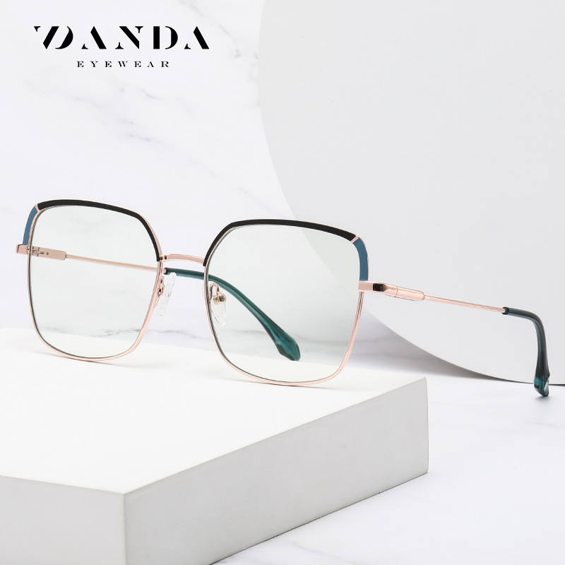 Nueva tendencia gafas marco de metal femenino de dos colores espejo plano JS8617 patada piernas tirachinas con miope anti-luz azul