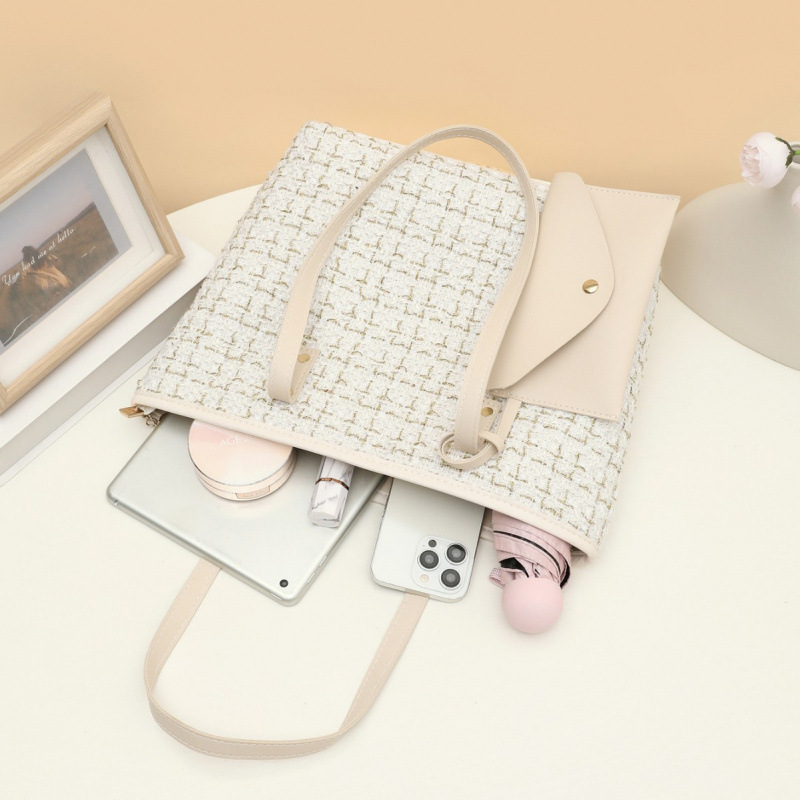2025 nuevo bolso de cubo de tela de tela de mano de mujer alta calidad bolso de hombro de moda temperamento universal nicho bolso de mochila
