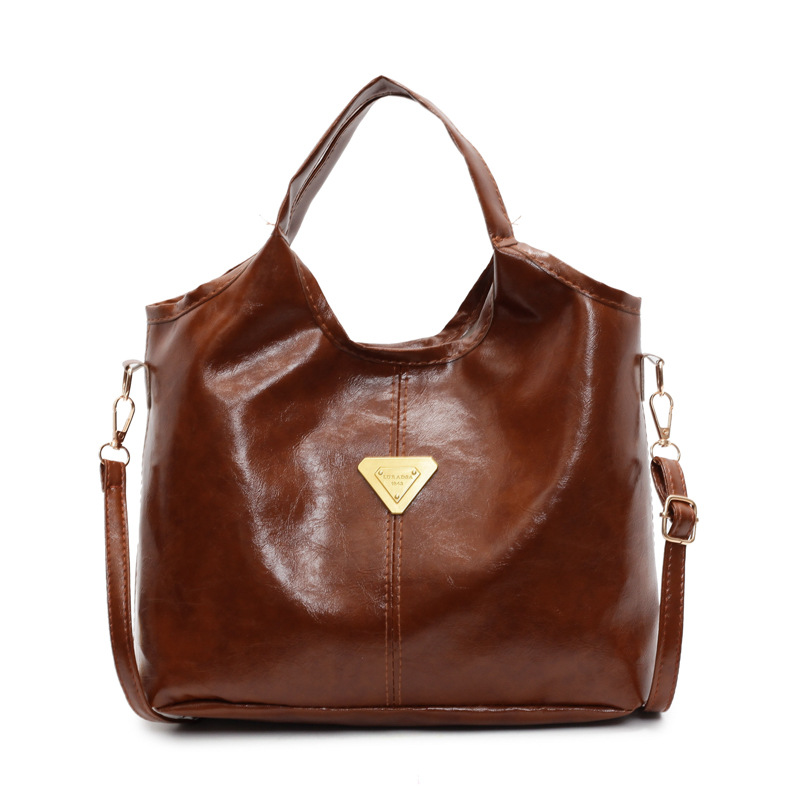 Tide retro nicho bolso de mano mujer 2025 primavera nueva piel de cera de aceite de transporte de gran capacidad bolso de hombro mochila