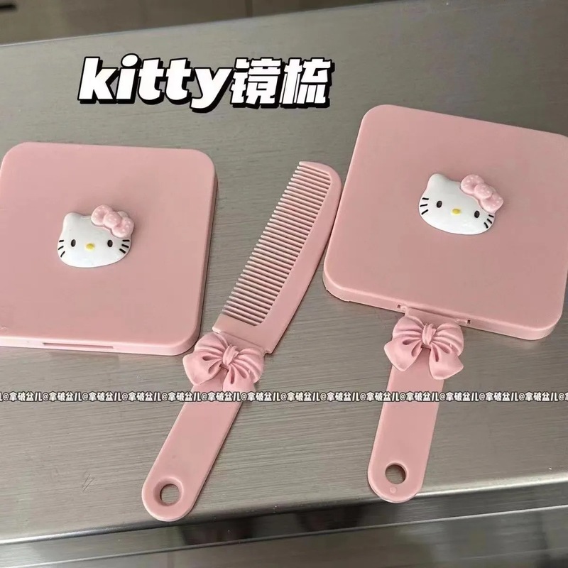新しい種類のkitty猫のハンドルの鏡は櫛を持って携帯して化粧の鏡の少女の心の鏡の櫛の一体の小さい鏡を持ちます。|undefined
