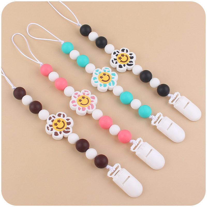 Nuevo bebé suministros de dibujos animados flor mordedor creativo bebé lindo silicona mordedura chupete cadena anti-gota cadena