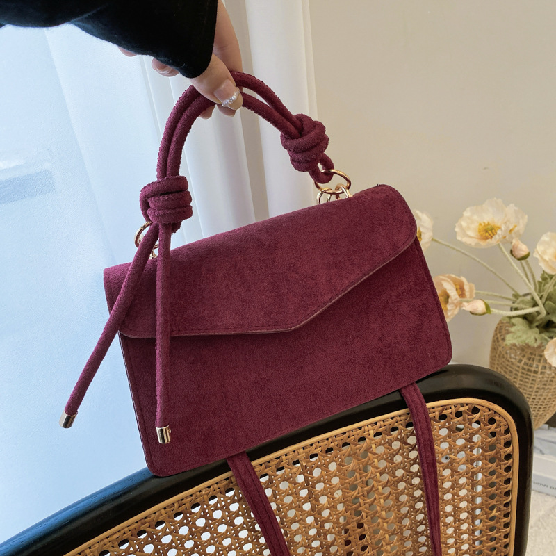 2024 otoño y invierno temperamento diseño de moda de un solo hombro aire extranjero color sólido retro textura simple bolso portátil