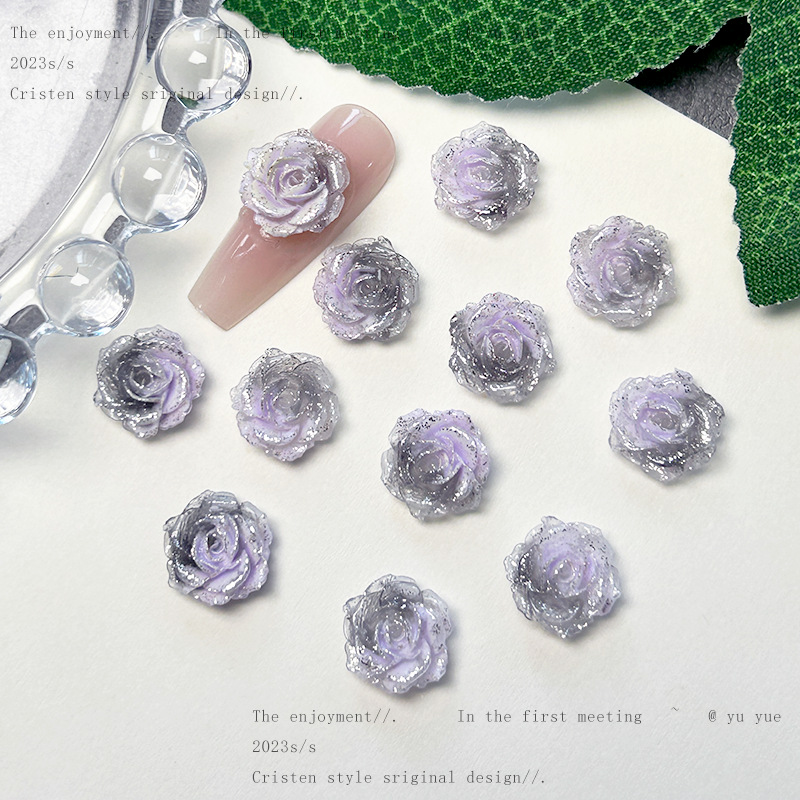 Nueva joyería de uñas de estilo gris-púrpura salvaje de estilo ins mezclada luminosa tridimensional de flores pequeñas accesorios de armadura al por mayor