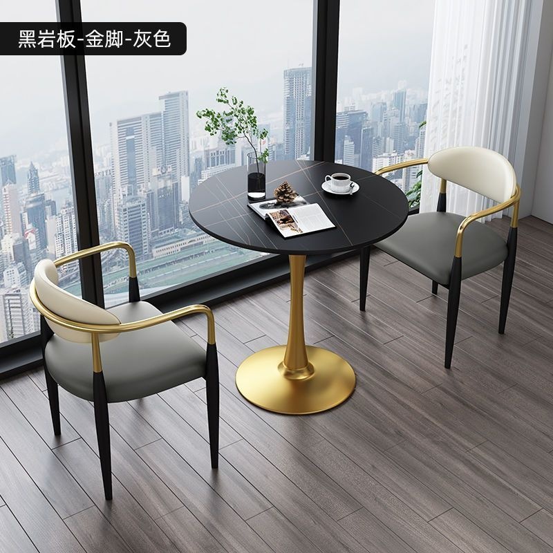 Gold legs + black rock slab + gray leather, one table and two chairs