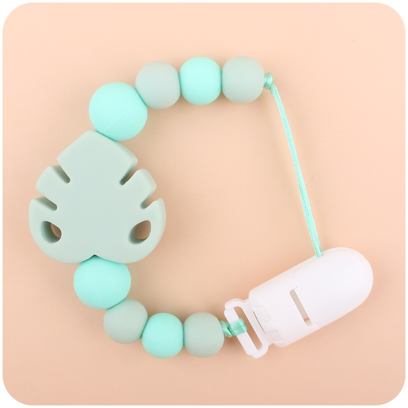 Suministros para bebés chupete cadena creativa bebé dibujos animados hojas silicona mordedura cadena anti-gota molar Nuevo