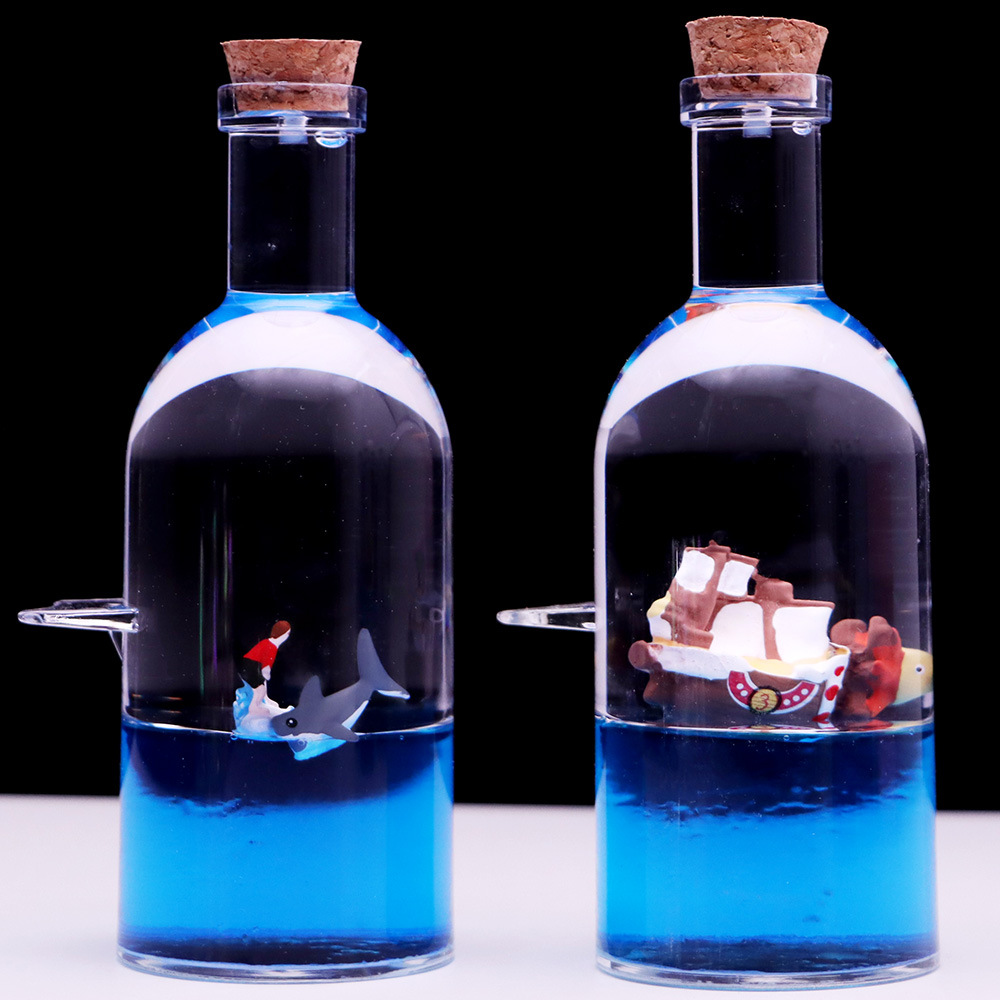 Botella a la deriva montando el viento y rompiendo las olas Botella de vela Perla Negra reloj de arena gotas de aceite Regalo de Cumpleaños descompresión decoración de escritorio al por mayor