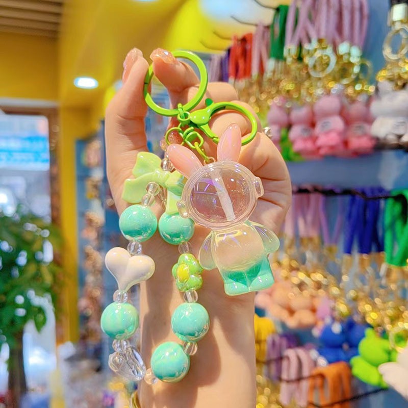 Auriculares de perlas conejo - verde rosa