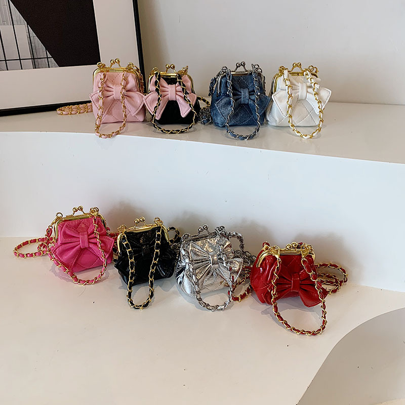Bolsos de hombro de princesa de estilo estilo diamante sólido arco bolso de hombro para niños nueva cadena bolso de abrazadera para niños