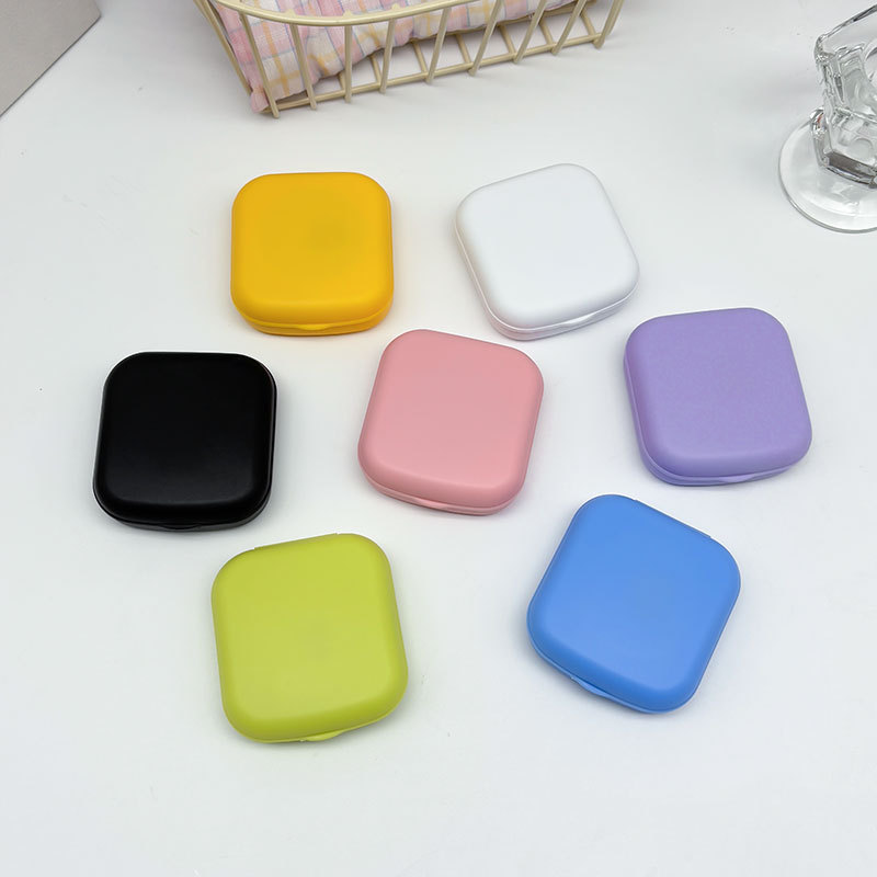 Nueva caja de lentes de contacto de color caramelo con espejo, caja de lentes de contacto de belleza de color sólido pequeña y portátil, caja de cuidado de lentes de contacto
