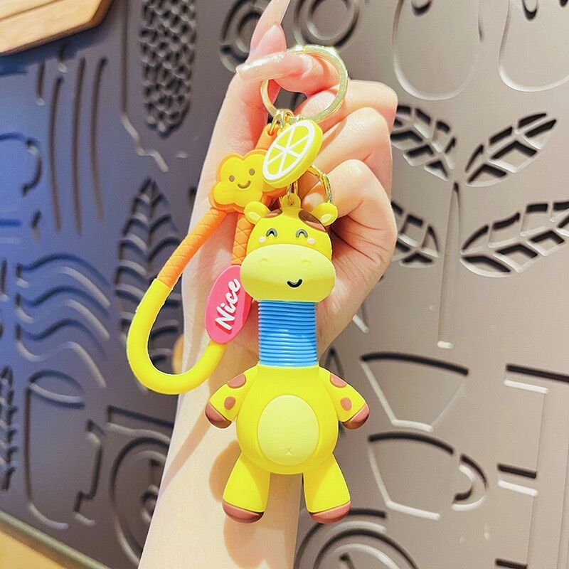 Llavero de cuello telescópico creativo de dibujos animados Divertido colgante de bolsa de descompresión colgante de coche cadena anillo pequeño regalo al por mayor
