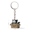 Please take away the red-mouthed black cat keychain