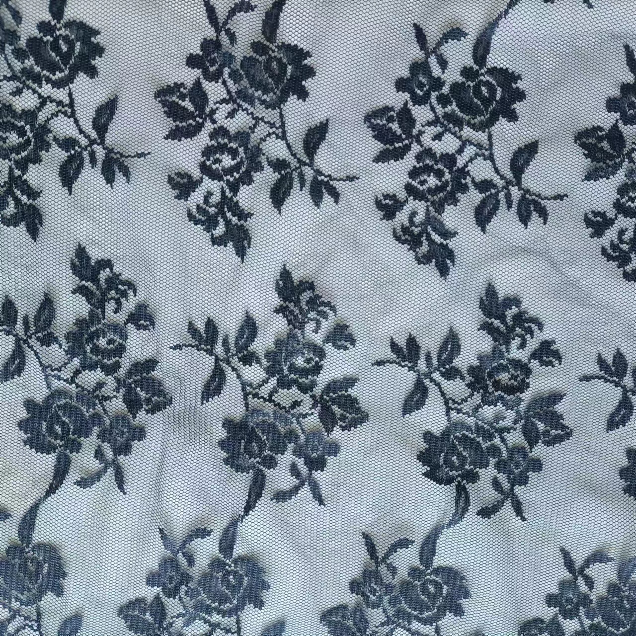 情趣蕾丝布料 无弹涤纶花型蕾丝面料 性感女装连衣裙网布布料现货