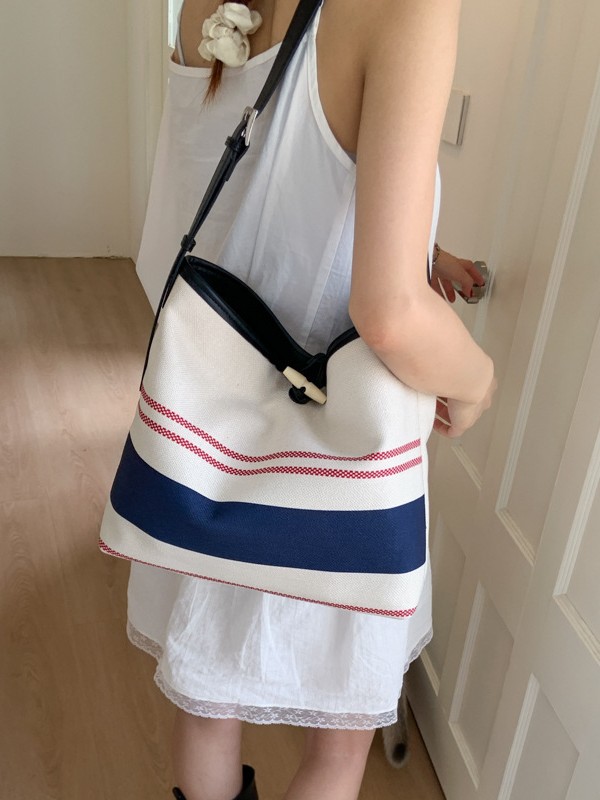 Bolso mujer 2025 nuevo bolso de cubo a rayas simple moda bolso de hombro casual de alta gama bolso de mensajero casual